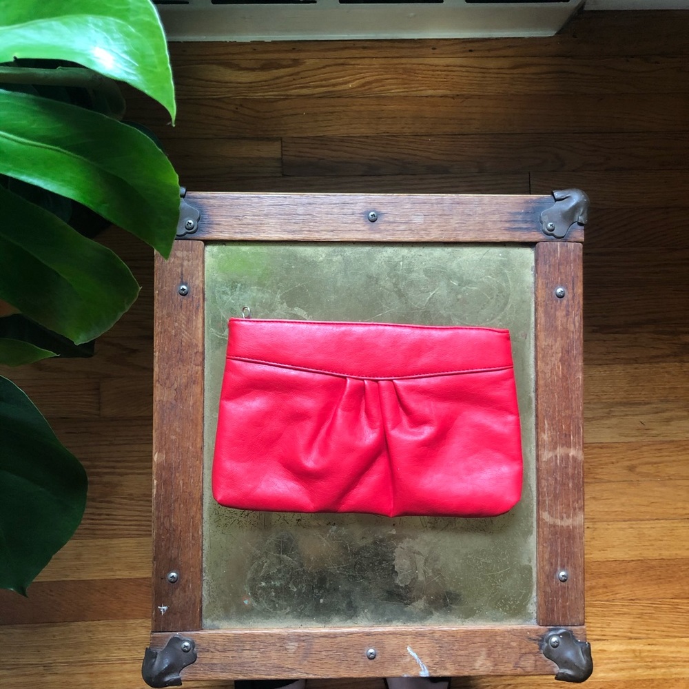 Red faux leather zip clutch
